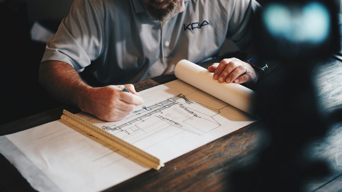 Architect reviewing construction drawings