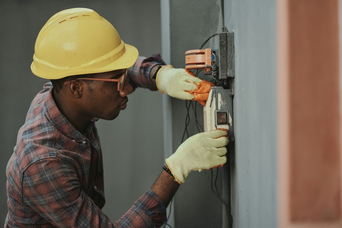 Electrician working on a distribution panel