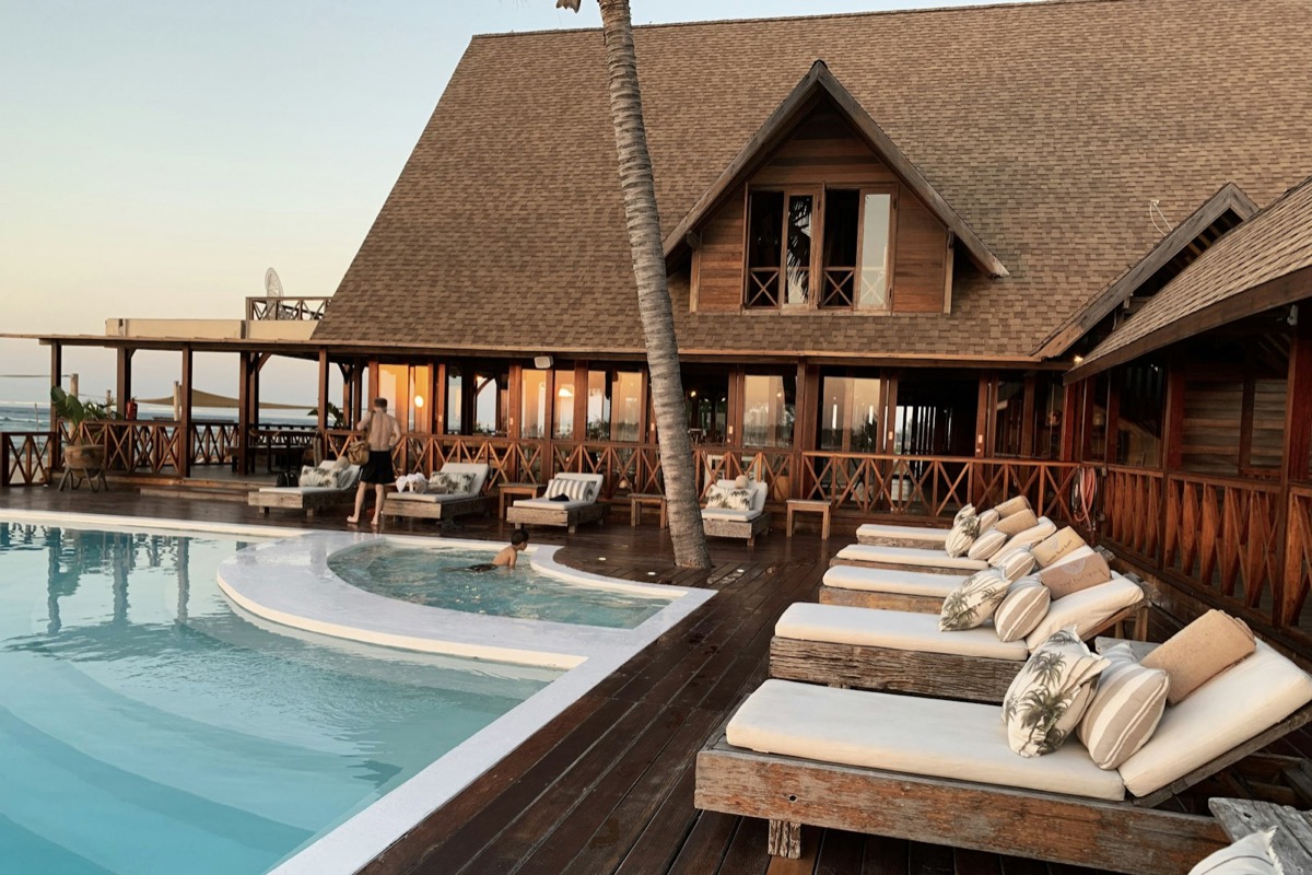 Resort pool deck with thatched pavilion
